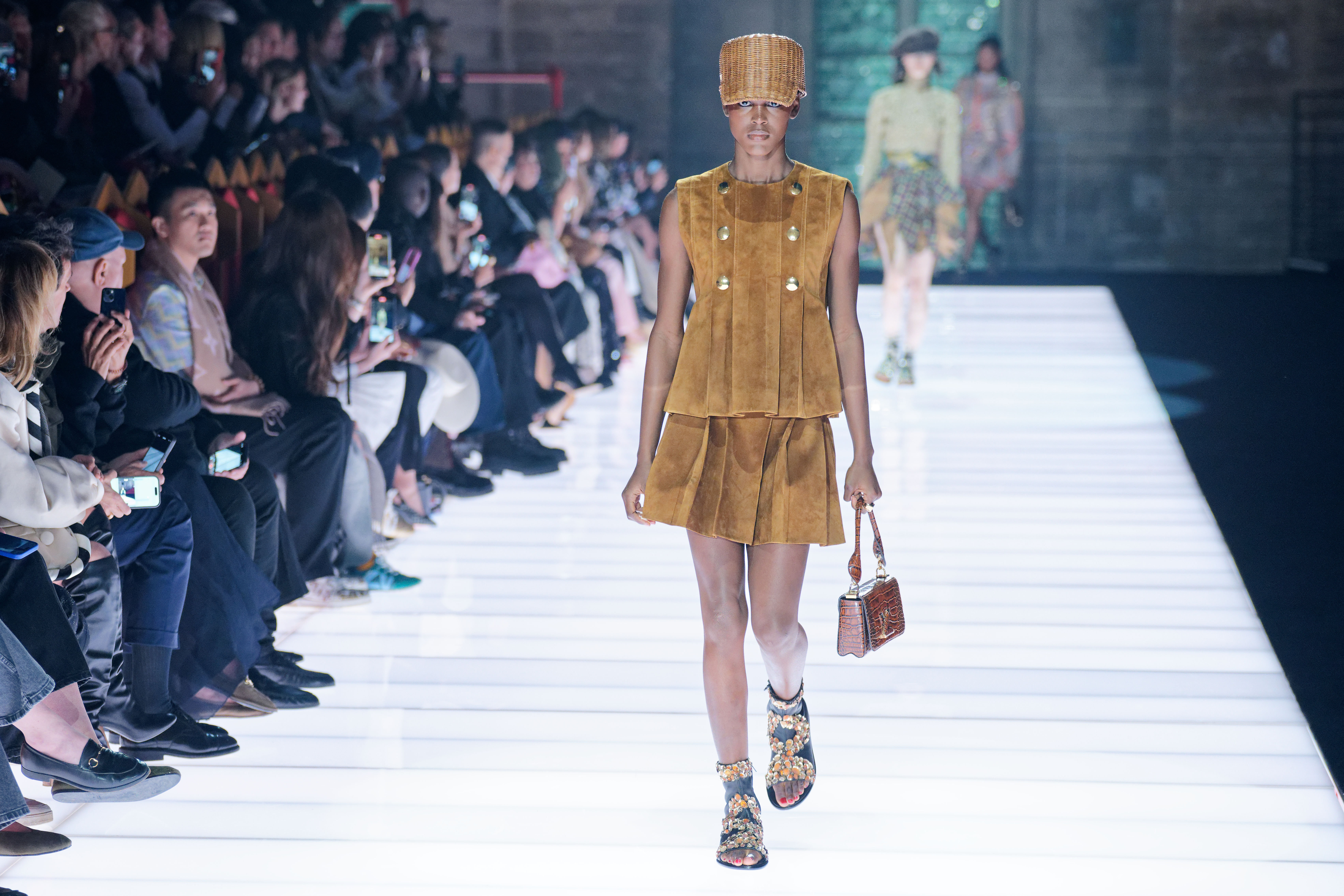 Model walking a Louis Vuitton runway.